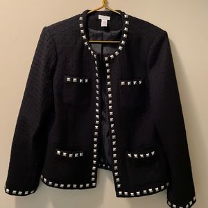 Chicos black blazer with decorative metal trim.